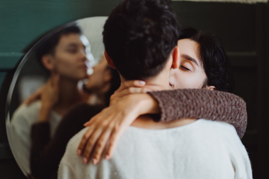 Couple sharing an intimate embrace during a boudoir session