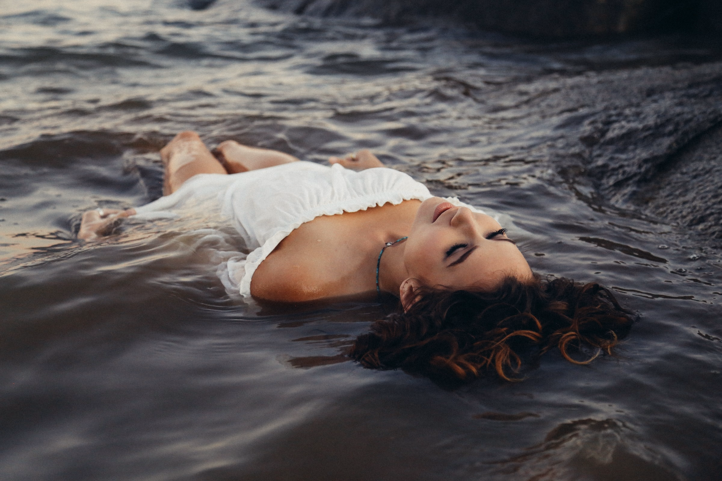 Lake Tahoe destination boudoir — woman in crystal-clear alpine water